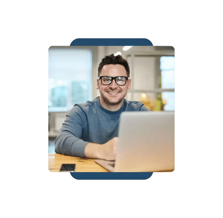 Smiling professional using SpineLegal Software for efficient legal management on a laptop.